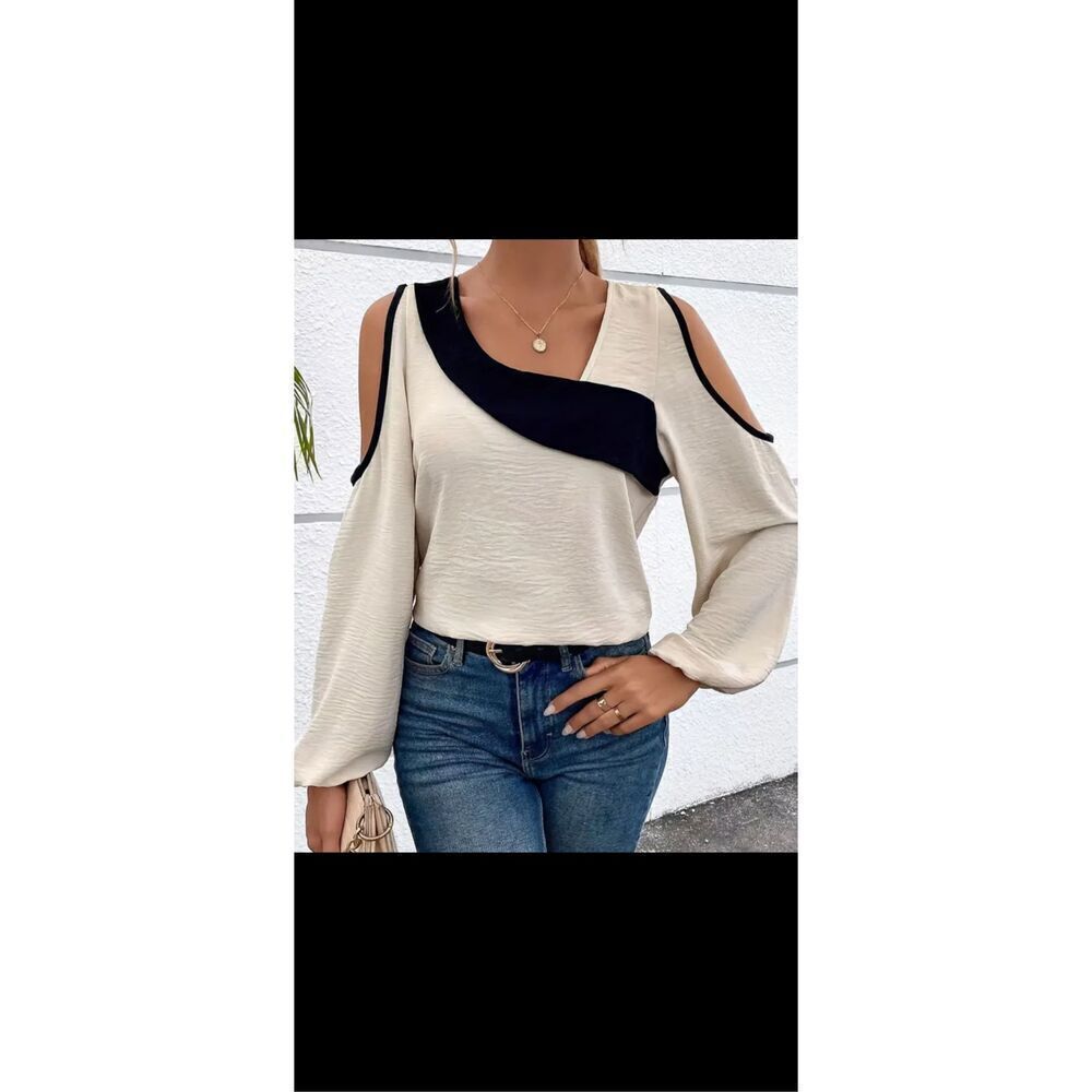 Beautiful cold, shoulder blouse, apricot/tan colored with black trim ,cold shoul
